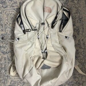 The North Face Cream Backpack with Bungee Front